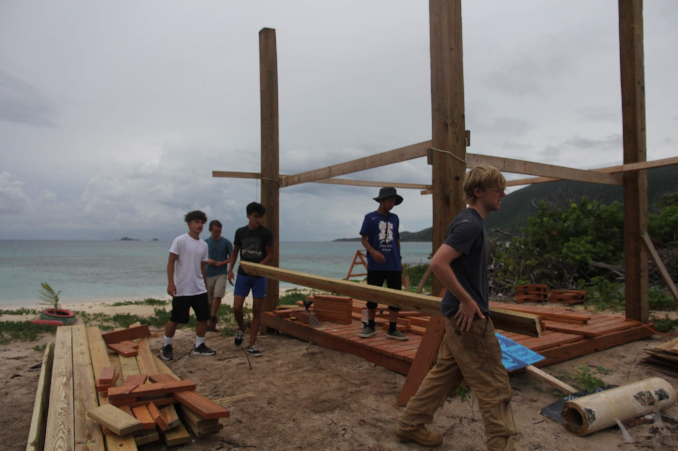 BVI sunshade repair team carrying beam